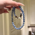 Double‑Strand Mottled Blue Beaded Stretch Bracelet With Wood Beads & Silver‑Tone Flower Charm For Women
