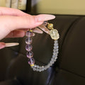 Two‑Strand Purple & Grey Beaded Stretch Bracelet With Carved Ornament & Gold‑Tone Metal Spacers For Women